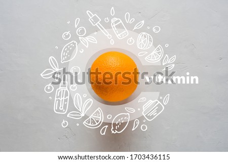 Orange and letter C on a yellow background. Concept of Vitamin C Doodle style icons image Flat lay Concept of protecting immunity during viral infection Royalty-Free Stock Photo #1703436115