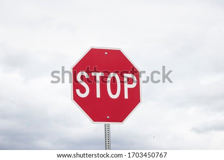 Red stop sign with sky  background. Safety and be careful driving. Road trip. 