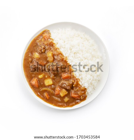 Japanese ordinary curry rice
 (Potatoes, carrots, onions and beef in spicy yellow curry served with steamed rice.) Royalty-Free Stock Photo #1703453584