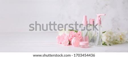 Different cosmetic products on light background with space for text