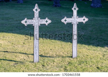 Old iron cross in the churchyard.