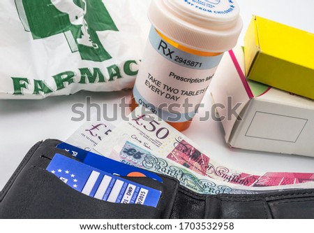 European health insurance card along with several capsules, concept of medical increase in the crisis of the brexit, conceptual image