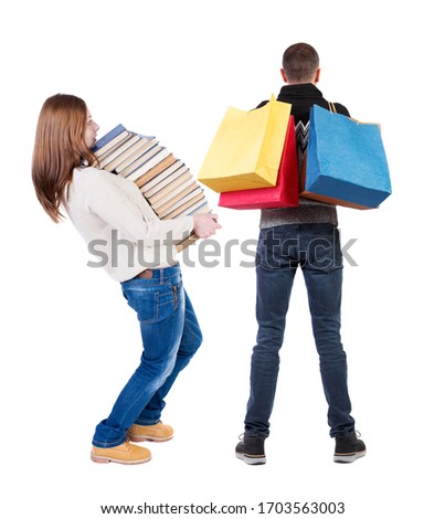 back view of couple with shopping bags. backside view of person. Rear view people collection. Isolated over white background.