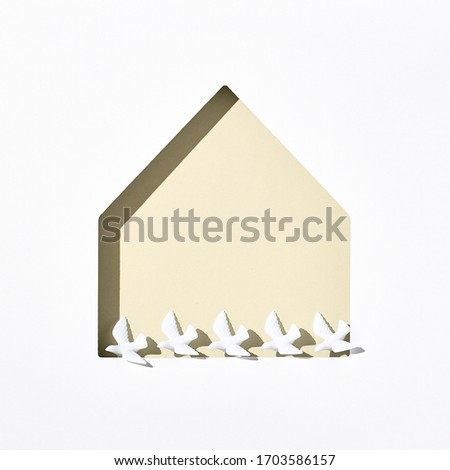 Minimal creative layout with white dove and house shape. Stay home, stay safe 2020 concept. Top view, flat lay. Pastel color
