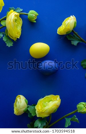 Happy Easter Day Around Yellow Flowers With Blue Egg On a Blue Background 