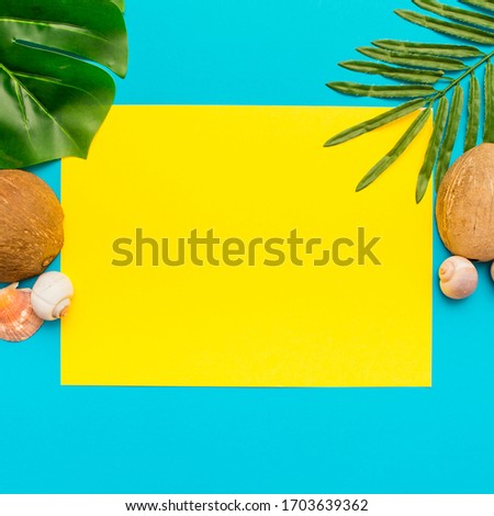 Different tropical leaves on a blue and yellow background