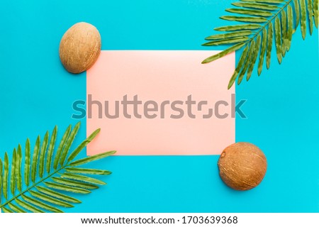 Palm leaves and coconuts with copy space for text