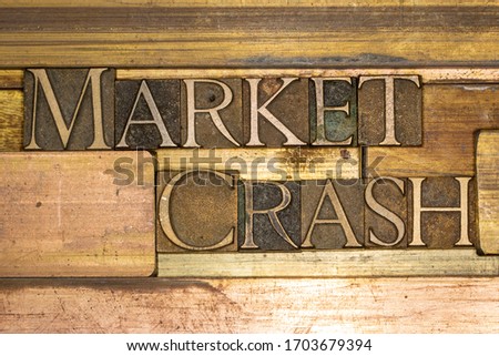 Photo of real authentic typeset letters forming Market Crash text on vintage textured grunge copper background