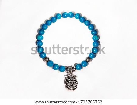 Ethnic bracelet with blue turquoise beads owl charm and silver 925 beads. Luxury jewellery for women for everyday or party