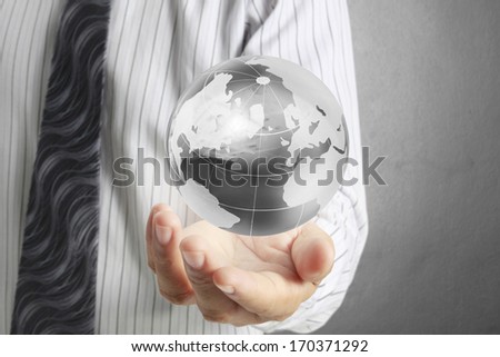 holding a glowing earth globe in his hands, Elements of this image furnished by NASA 