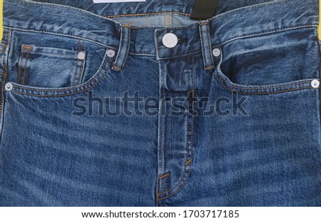 Blue jeans . Detail of vintage blue jeans texture with pocket

