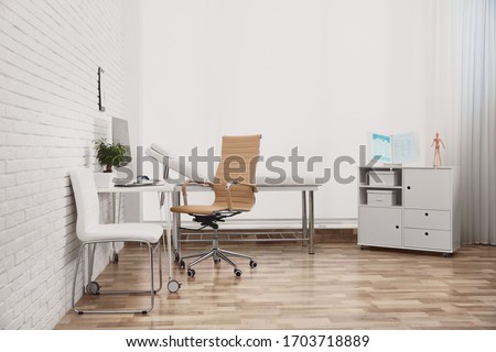 Interior of modern medical office. Doctor's workplace Royalty-Free Stock Photo #1703718889