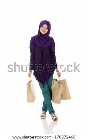Beautiful muslim woman feel happy holding shopping bags