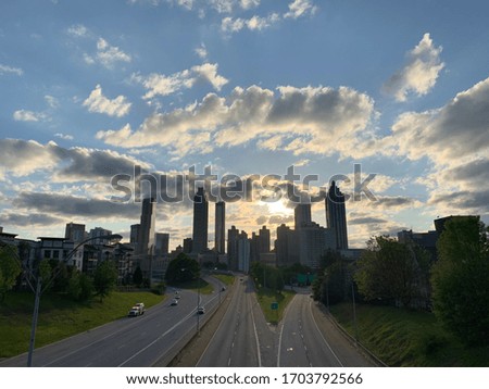 Downtown Atlanta skyline with blue sky and clouds during early sunset