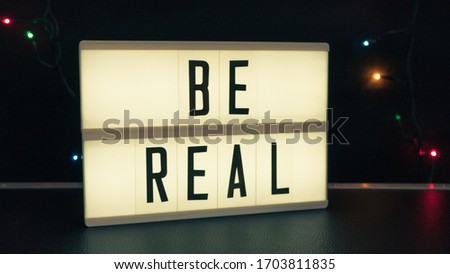 blacklight box isolated with text "be real" 