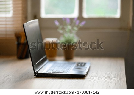 A laptop on the desk for work at home during the epidemic virus.