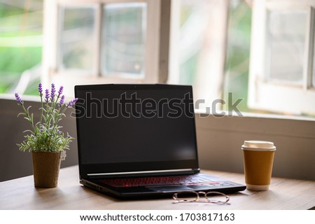 A laptop on the desk for work at home during the epidemic virus.