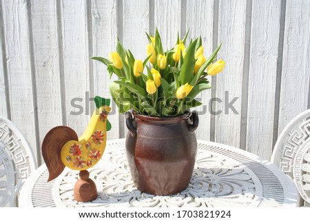 Easter picture with yellow Tulips and Easter cock beside