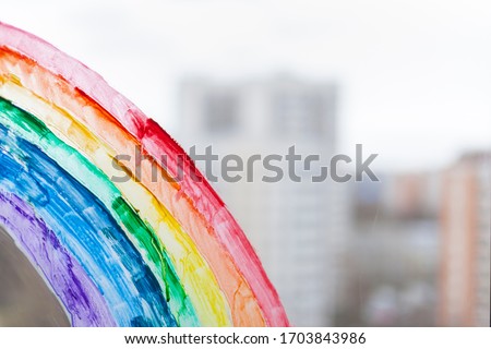 painting rainbow during Covid-19 quarantine at home. Stay at home Social media campaign for coronavirus prevention, let's all be well, hope during coronavirus pandemic concept Royalty-Free Stock Photo #1703843986