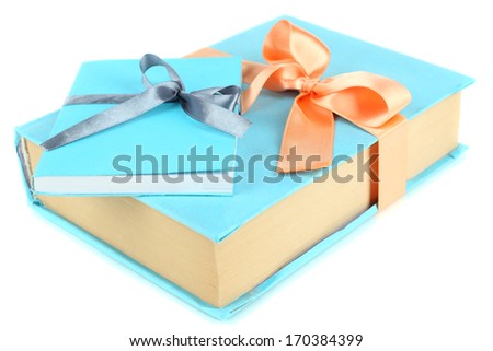 Books wrapped with color ribbons, isolated on white