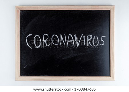blackboard with coronavirus and other medical elements related to the pandemic
