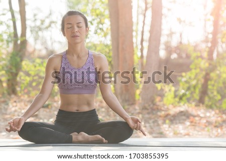 calmness and relax, female happiness.Horizontal, blurred background. young woman meditates while practicing yoga. freedom concept. calmness and relax, woman happiness. toned picture healthy life