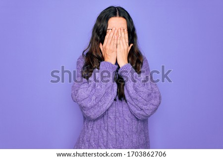 Young beautiful woman wearing casual turtleneck sweater standing over purple background rubbing eyes for fatigue and headache, sleepy and tired expression. Vision problem