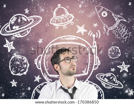 Concept of dreaming businessman with element of the space