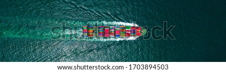 Aerial view container cargo ship in ocean, Business industry commerce global import export logistic transportation oversea worldwide, Sea shipping company vessel, copy space for web banner. Royalty-Free Stock Photo #1703894503