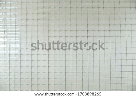 Square iron pattern in glass. Concept for decoration and background.