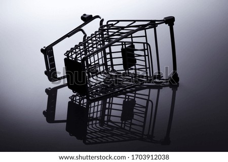 Miniature shopping trolley with exciting studio lights