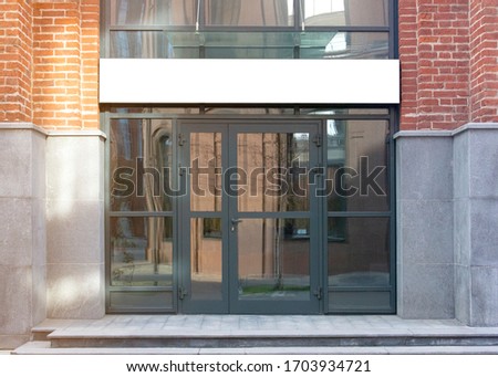 Blank white rectangular box store entrance mockup, glass brick wall. Empty exterior signage on business center mock up, front view. Clear display or lightbox on edifice for boutique mokcup template.