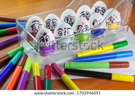 Easter eggs on the theme of coronavirus, painted funny masked faces on Easter eggs, decorated for Easter,