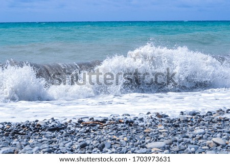 Raging blue sea in Abkhazia. Summer day. Sea breeze