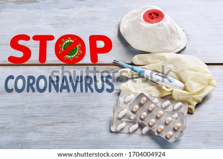 stop coronavirus background with inscription and medical mask,thermometer, rubber gloves and pills