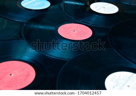 mockup Musical vinyl record. vinyl mockup. Vinyl record with scratches on white background. Royalty-Free Stock Photo #1704012457