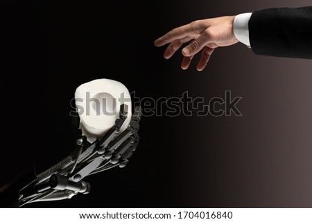 Helping people with their future.cyborg hand gives people paper.side view,technical helps