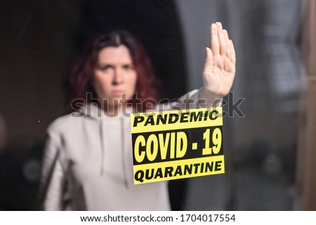 Woman showing stop gesture. Girl show stop palm. Stop coronavirus or covid-19 and the pandemic. Stay home. Quarantine concept.