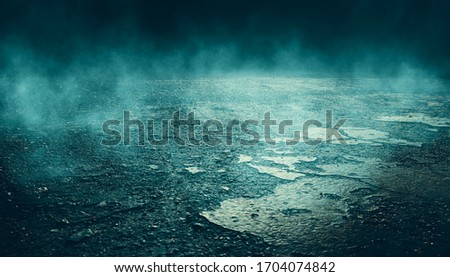 Dramatic background of night street, spotlight on asphalt, smoke