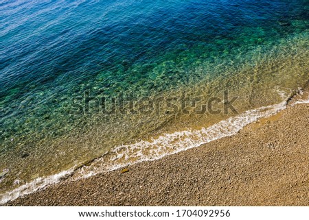 Transparent sea water in a sunny day 
