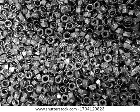 steel screws are scattered, nuts and screws, Background for the design