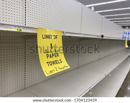 A view of empty paper product shelves at a department store during the Coronavirus pandemic of 2020.