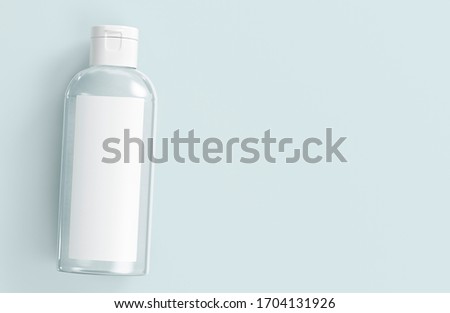 Сlear white cosmetic bottle lying on white background. Hand sanitizer bottle. Antimicrobial liquid gel. Hand hygiene. Shampoo bottle. 3D rendering. Royalty-Free Stock Photo #1704131926