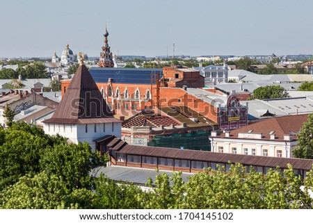 Top view of Yaroslavl cityscape with orthodox churches, belfries, old buildings, fresh green trees, tower and wall of Spaso-Preobrazhensky monastery