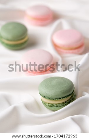Macaroon pink and mint delicious with blueberries and strawberries and tea