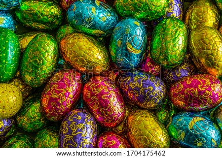 Easter chokolate eggs, different color. Chokolate candy. Background.