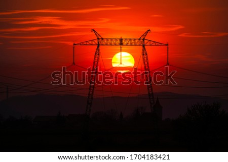 Solar dish at the sunset and red sky