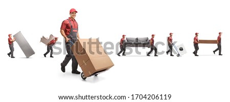 Male workers carrying furniture and boxes on a hand-truck isolated on white background