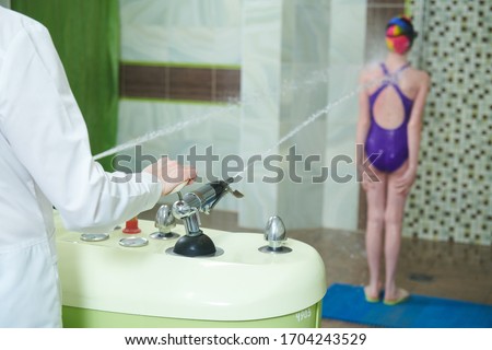 Charco douche. Water massage. Medical manipulation treatment procedure Royalty-Free Stock Photo #1704243529