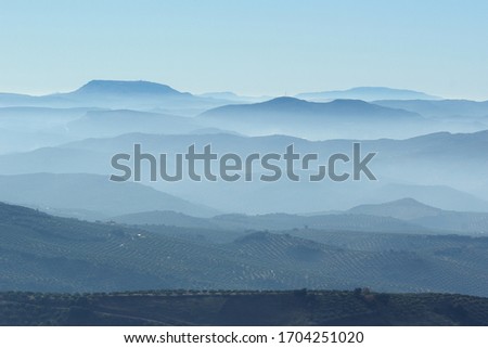 landscape view from a high mountain with far hills in the background